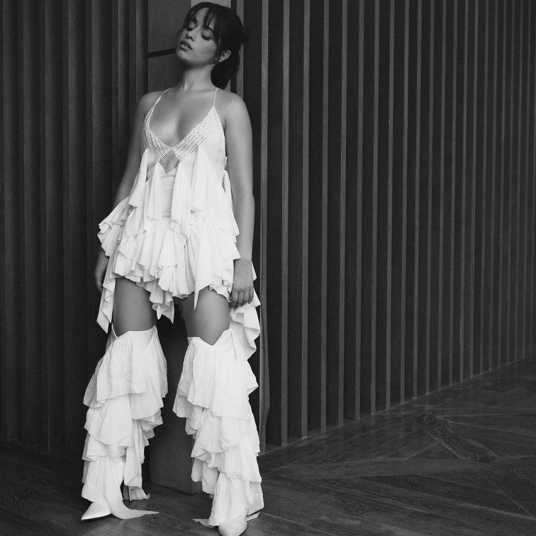 Camila Cabello being erotic in white dress cleavage exposed