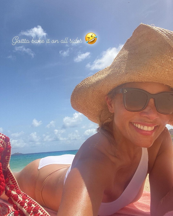 Michael Michele sun bathing in bikini shows her cleavage