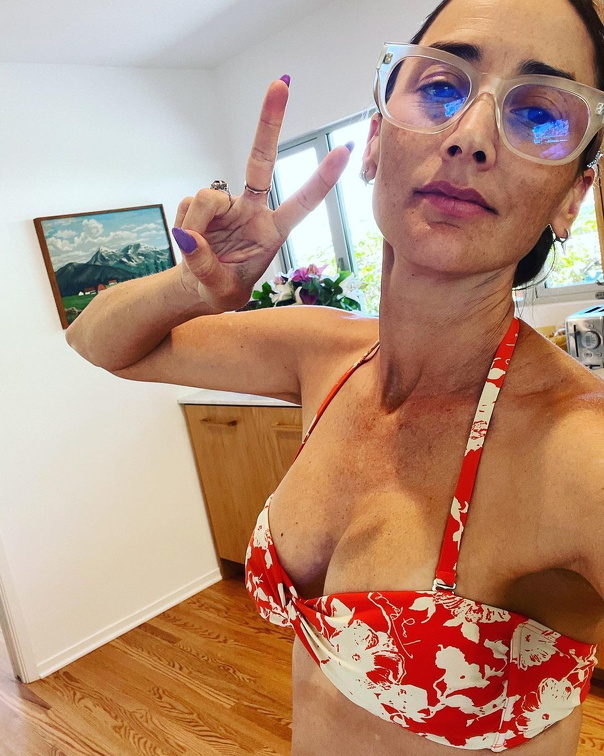 Bree Turner shows cleavage in bikini