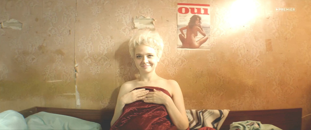 Nadezhda Ivanova covers her naked body with a sheet