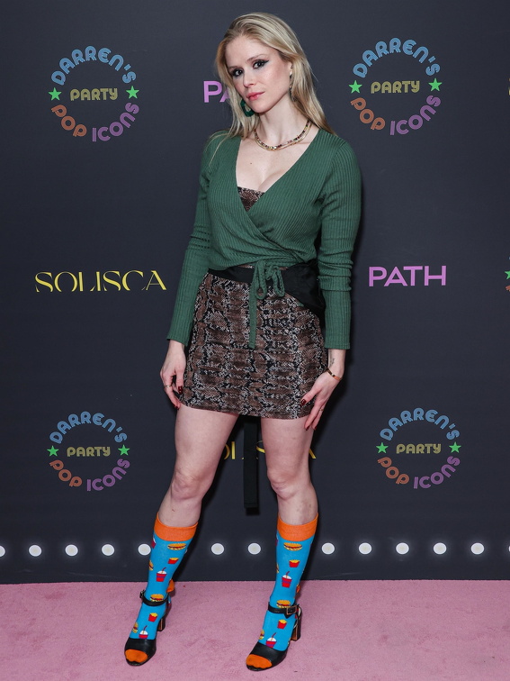 Erin Moriarty wears funky socks and high heels exposing her milky legs