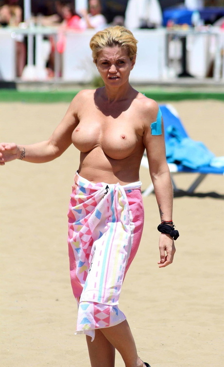 Danniella Westbrook shows massive fake boobs on the beach