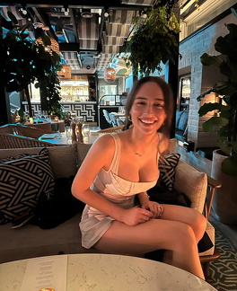 Elsie Hewitt shows cleavage in a sexy short dress
